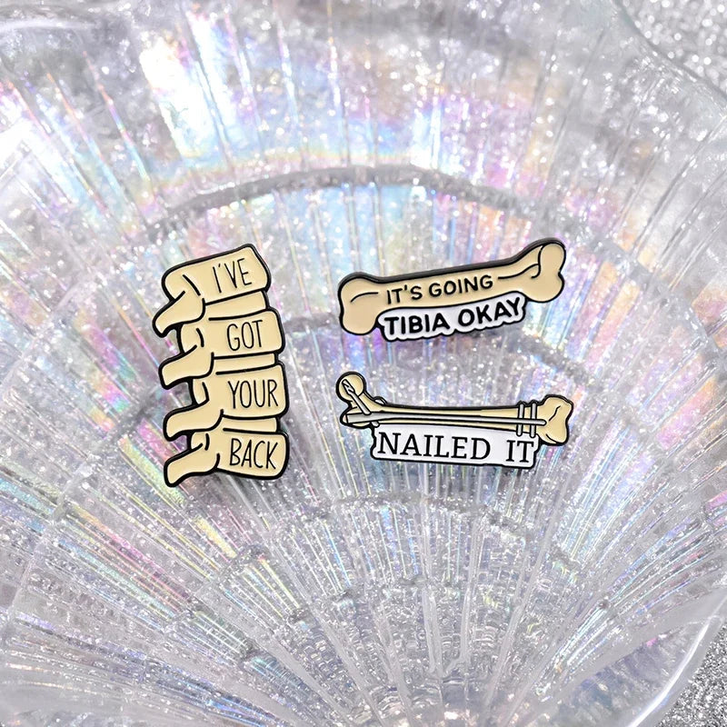 "It's Going Tibia Okay" Enamel Pin — Funny Medical Bones & Spine Brooch Lapel Badge Gift for Doctors & Nurses